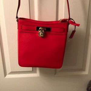 Red Michael Kors crossbody purse